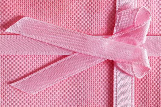 Pink gift box with tied ribbon. Christmas, Valentine's day, birthday concepts