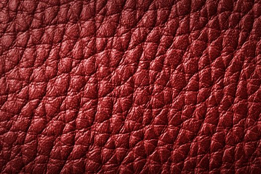 Genuine red leather background, pattern. High resolution photograph.