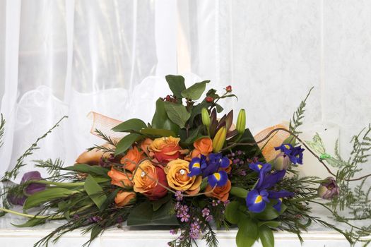 Wedding Table flower arrangement with orange roses