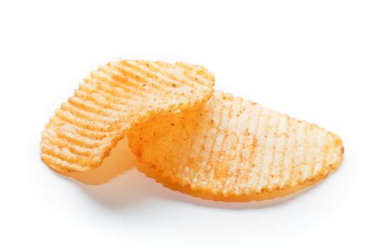Two spiced potato chips isolated on white background