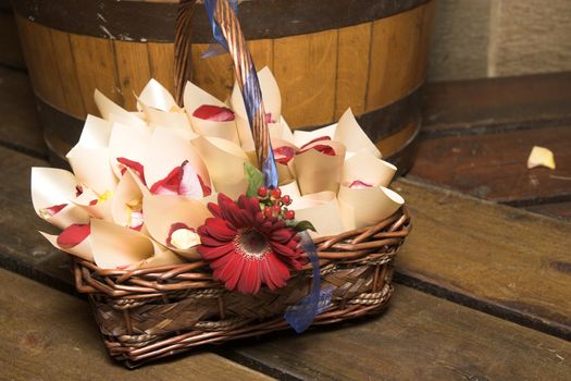 Basket containing cones filled with rose petals