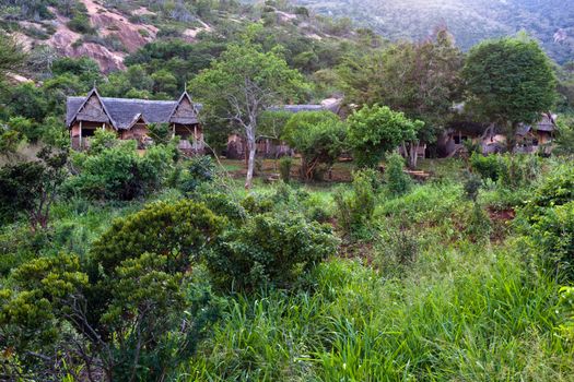 Tourist, safari lodgy in bush in Tsavo West, Kenya Africa.