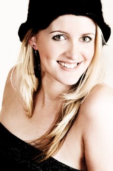 Beautiful young blond model wearing a black hat