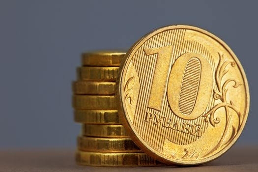 stack of a coins on the gray background