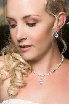 Beautiful Blond bride wearing diamond jewelery