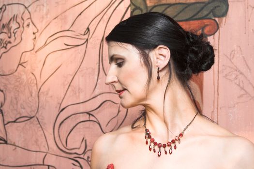 Beautiful Brunette bride with red beaded necklace