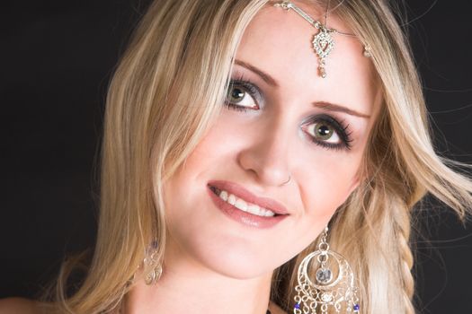 Beautiful Blond Belly Dancer with traditional jewelery