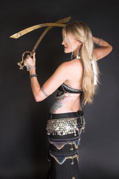 Belly Dancer hands holding two tribal swords