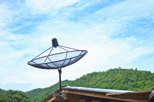 Satellite dish with sky on roof