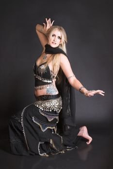 Blond Belly Dancer in a belly dance position