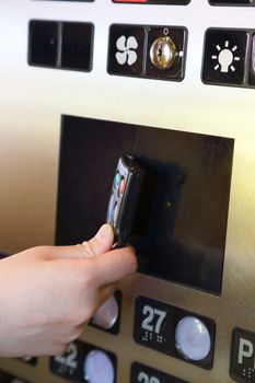 Tapping key tag on elevator