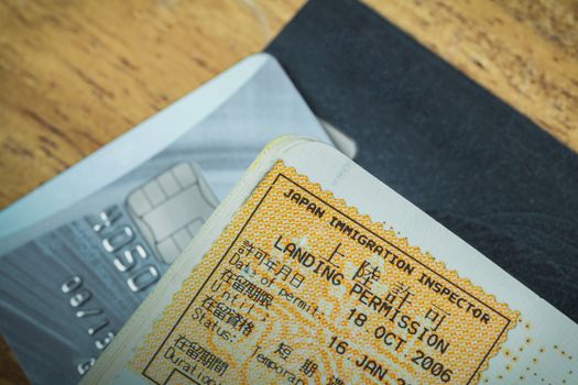 Passport stamp visa of Japan and credit card for travel concept
