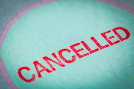 Passport stamp cancelled for travel concept background