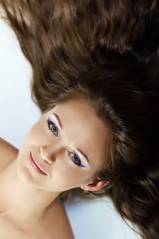portrait of young girl with beautiful make-up and long hair