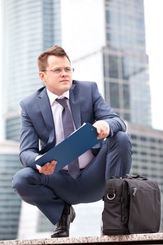 Successful businessman with planning  and briefcase