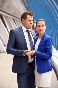 young man and woman standing together