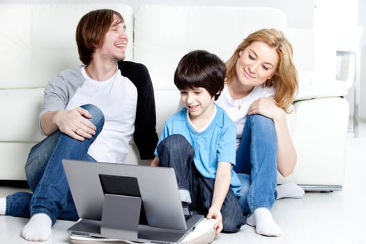 parents with children, on laptop computer
