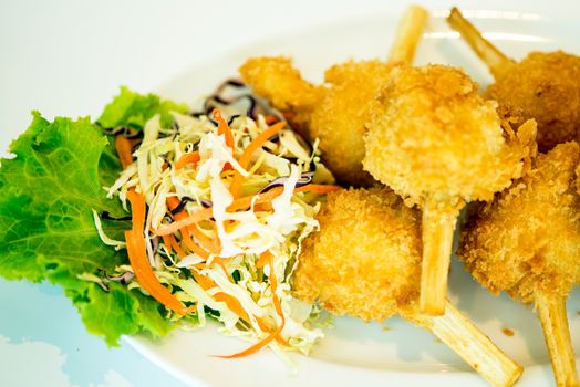 Sugar cane skewered fried minced shrimps or Chao tom - Vietnamese food