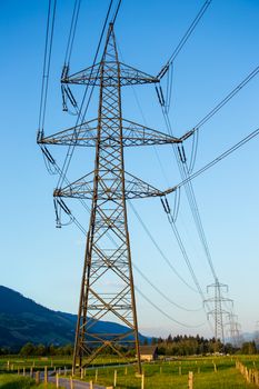The powerlines with the blue clear sky