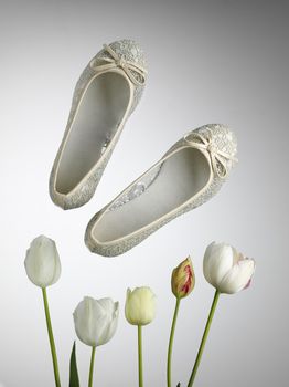 pair of 
summer season woman's shoes with tulips