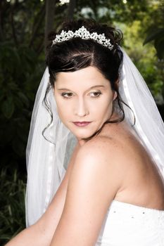 Beautiful brunette bride wearing a diamond tiara