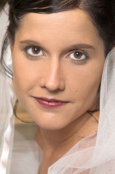 Beautiful brunette bride close up, looking into the camera