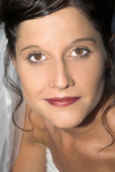 Beautiful brunette bride with hazel eyes, close up