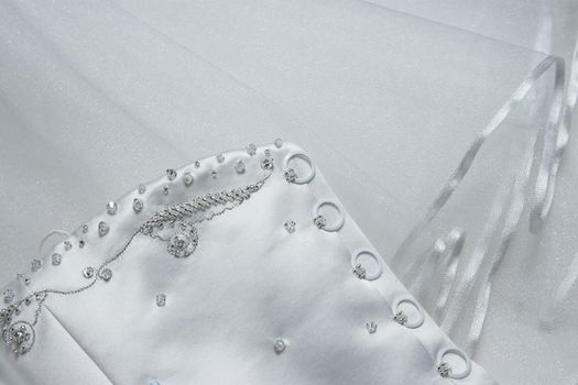 Detail of stiching and beads on a wedding dress