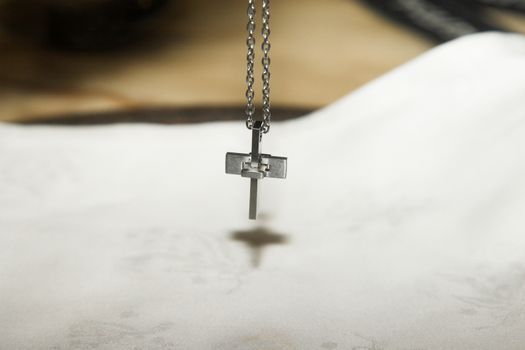 Piece of jewelery, silver cross on a chain