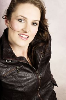 Beautiful young female wearing a leather jacket