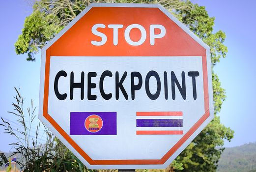 The label is the thai border police's stop checkpoint on a border road of Thailand.