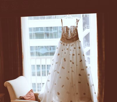 Wedding dress in room with retro filter effect
