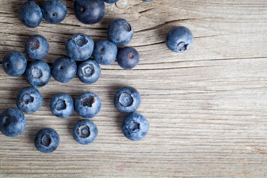 Fresh Blueberries on wooden Background