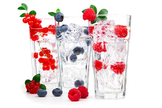 juice / cocktail with currant, raspberry, blueberry and ice, isolated on white background