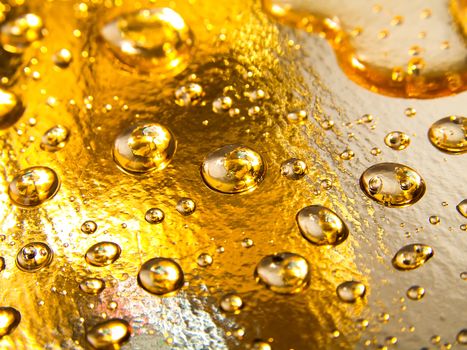 drops of water on golden background