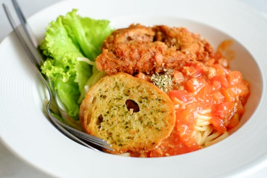 pasta with meatballs and parsley with tomato sauce