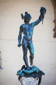 Perseus holding head of Medusa, bronze statue by Benvenuto Cellini in Loggia de Lanzi, Piazza della Signoria, Florence, Italy