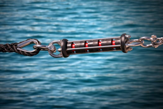 Shock absorber for mooring of boats at the harbor with black nylon rope (pier)