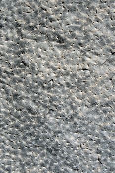 Close up of hand-hammered ancient stone floor (italian castle in La Spezia), gray rock, perfect for a background