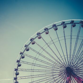 Retro Vintage Style Photo Of A Ferris Wheel At An Amusement Park At Dusk
