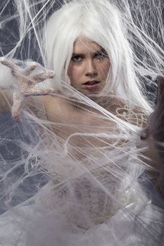 beautiful young woman trapped in a spider web, communications