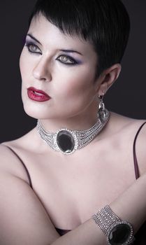 Sexy woman with elegant silver jewelry
looking interesting