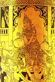 detail of thai pattern that made by covered wood plate with gold leaf for decorated temple door or pillar,shallow focus
