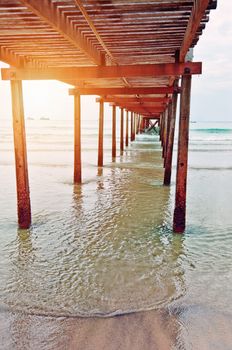  pier stretching into the sea at sunset.Thailand