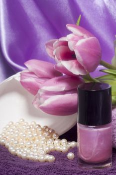 nail polish and tools  for manicure on  elegant fabric