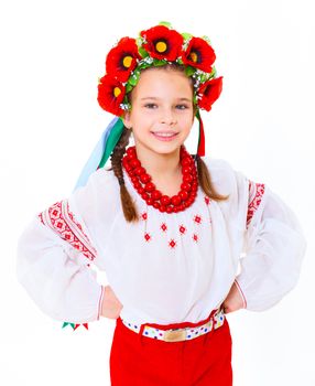 A little girl in Ukrainian national dress on the white background