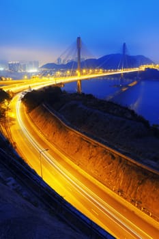 Highway traffic Ting Kau bridge at sunset