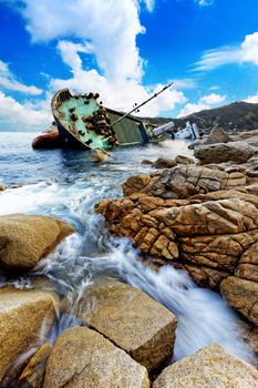 shipwreck close bay in hong kong sunshine blue sky white cloud