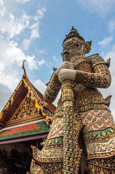 the wat Phra Kaew shelter the most sacred image of Thailand the Emerald Buddha.  View of a giant or yakshas