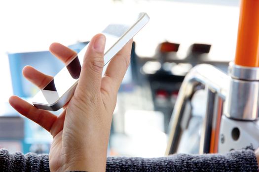 Woman Using a Smart Phone on the bus